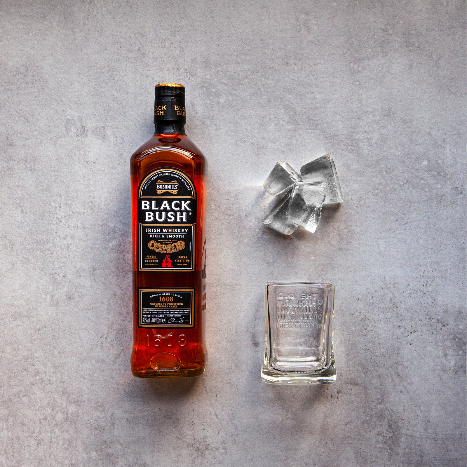 bushmills black bush on concrete beauty shot bushmills black bush on concrete beauty shot